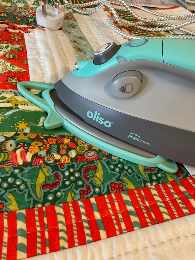 AD
I was lucky enough to have been using the @olisohome iron when they first came out in the US and we had them in classes when I was teaching. And when they came over to the UK I was thrilled. But this is the newest edition, the Project Iron! I’ve run it through its paces and it hits all the goals.
I love the size, not too big or too small, so really packs a punch for ironing when you are in classes or on retreat.
The grip is nice and chunky so you can have a firm hold without feeling that you are clinging on, like you do with a mini iron 🤣.
It’s a got a nice long cable, I know that might not seem the first thing to look for, but you don’t want to be pressing and squashed up at the pug socket.
It has its own protective cover for travel which fits like a shoe, so won’t slip off.
Said cover then turns into a mat to sit the hot iron on.
There is steam and heat settings and a standby button so you can press it to get back to the heat you used.
There’s a headlight! So good for focussing in on the fiddly bits.
And last but not least it’s a fun colour 😃.
All in all it’s a great addition to a stitchers arsenal, and if you want to keep it all tidy together there’s the option of the carry case. 
All in all I’m excited to have this for workshops so if I’m teaching for you next year, ask to have a go! 
@grovesltd 
#olisohome #projectiron #miniiron #irons #sewing #stitchersofınstagram #quiltteacher #grovesltd #pressing #ironing g
