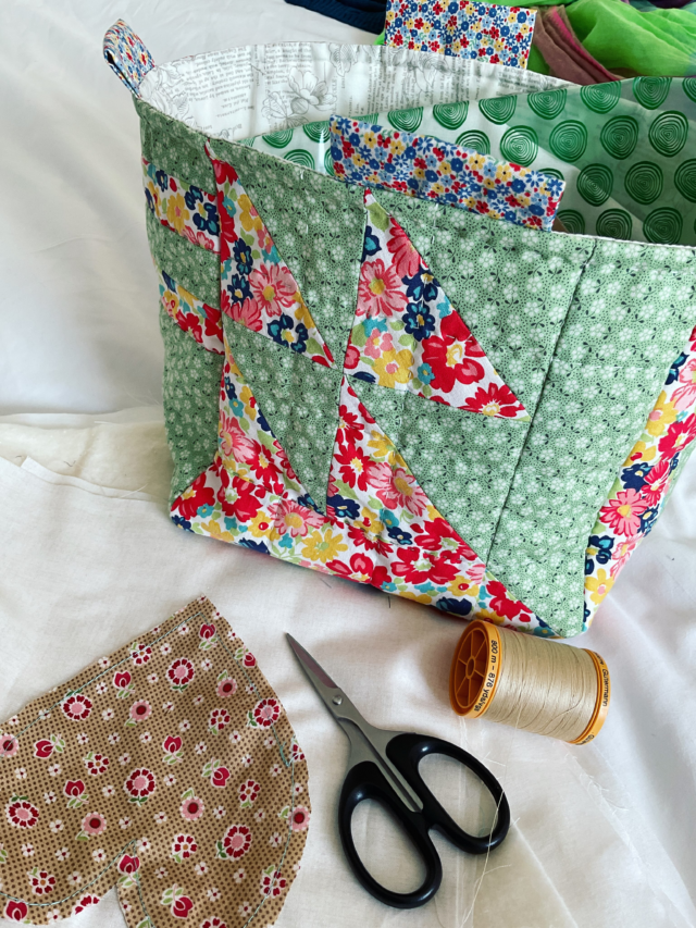 @seams_collective September posting challenge continues today, day 21 with the prompt, Time.
I’m often told that I must spend a lot of time sewing .
And it’s true, to get all the ideas I have out there into fabric then I need to spend the time stitching them.
But I stitch different things at different times. 
My machine stitching is generally done during the day, and mostly after I’ve completed other tasks.
My hand stitching of any sort is done in the evening, but the prep will be during the day. If I’m travelling then there is always a hand stitching project on the go, literally, and that’s one of the reasons the Quilt as you Go appeals to me so much, that by planning and deciding on your project you can literally make a quilt anywhere 😃🪡🧵. 
I also stitch on trains and planes and in hotel rooms. I’m always glad of a nice crisp whit duvet cover to photograph projects on 🤣. The above a is my hotel room sewing today, making the most of time before I visit with a group to give a talk, ironically on QAYG ! 
I definitely find that by having a a number of sewing techniques to draw on, there is always a time when I can be stitching! 
#quiltingonthego #septtextilelove #carolynforster #sewingonthego